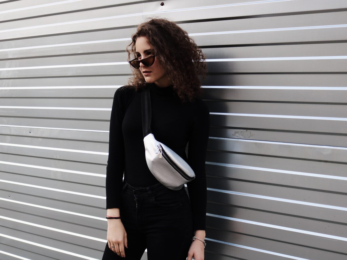 standing woman near wall