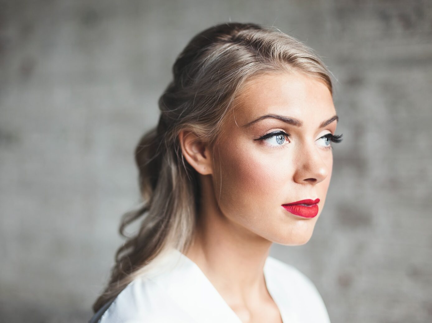woman wearing white shirt with red lipstick