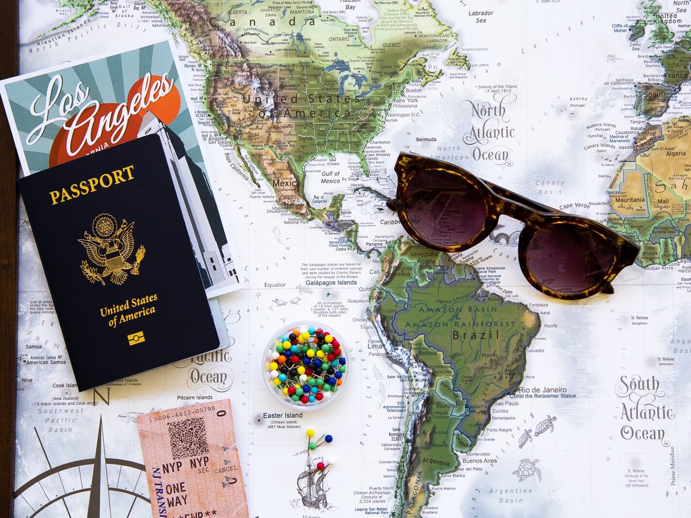 brown framed sunglasses on map