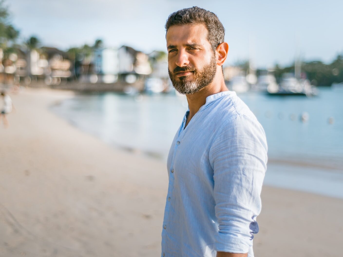 man standing on beach during daytime