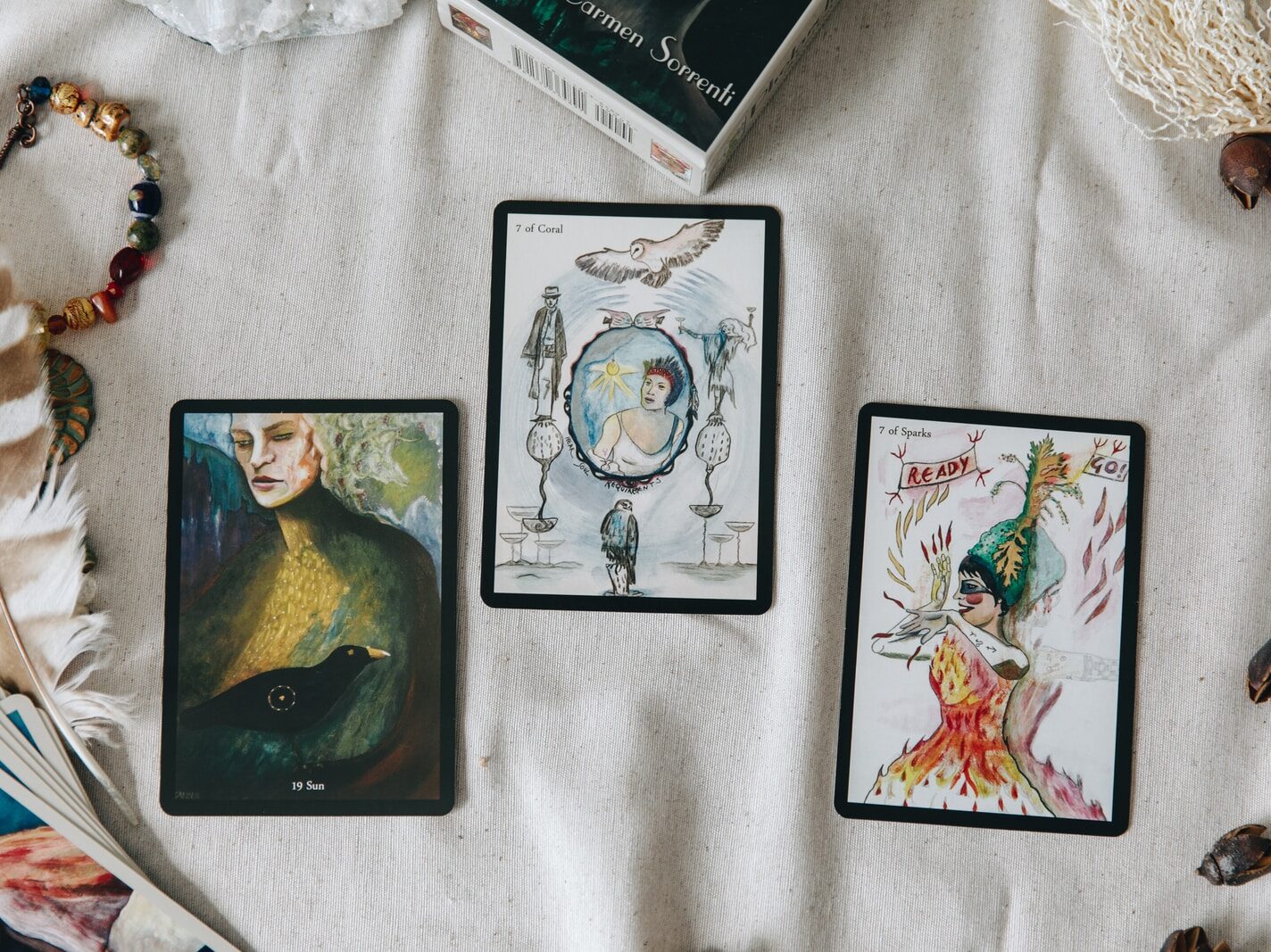 2 black and white cards on white textile