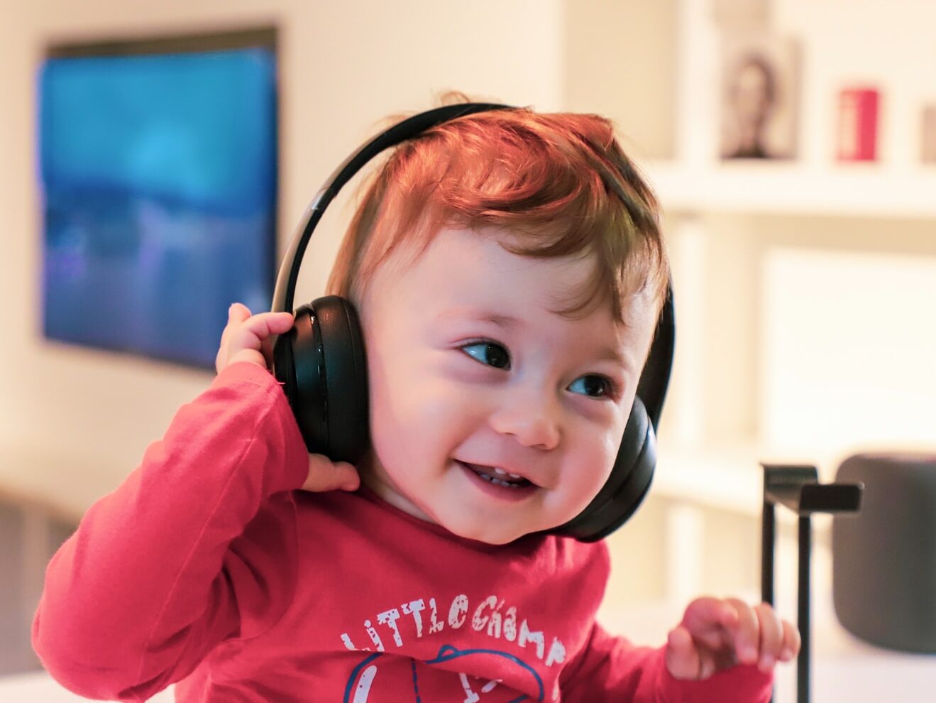 baby listening in black headset