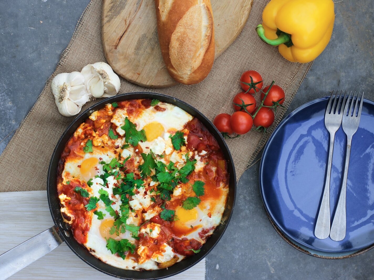 steam pasta beside tomatoes and plate