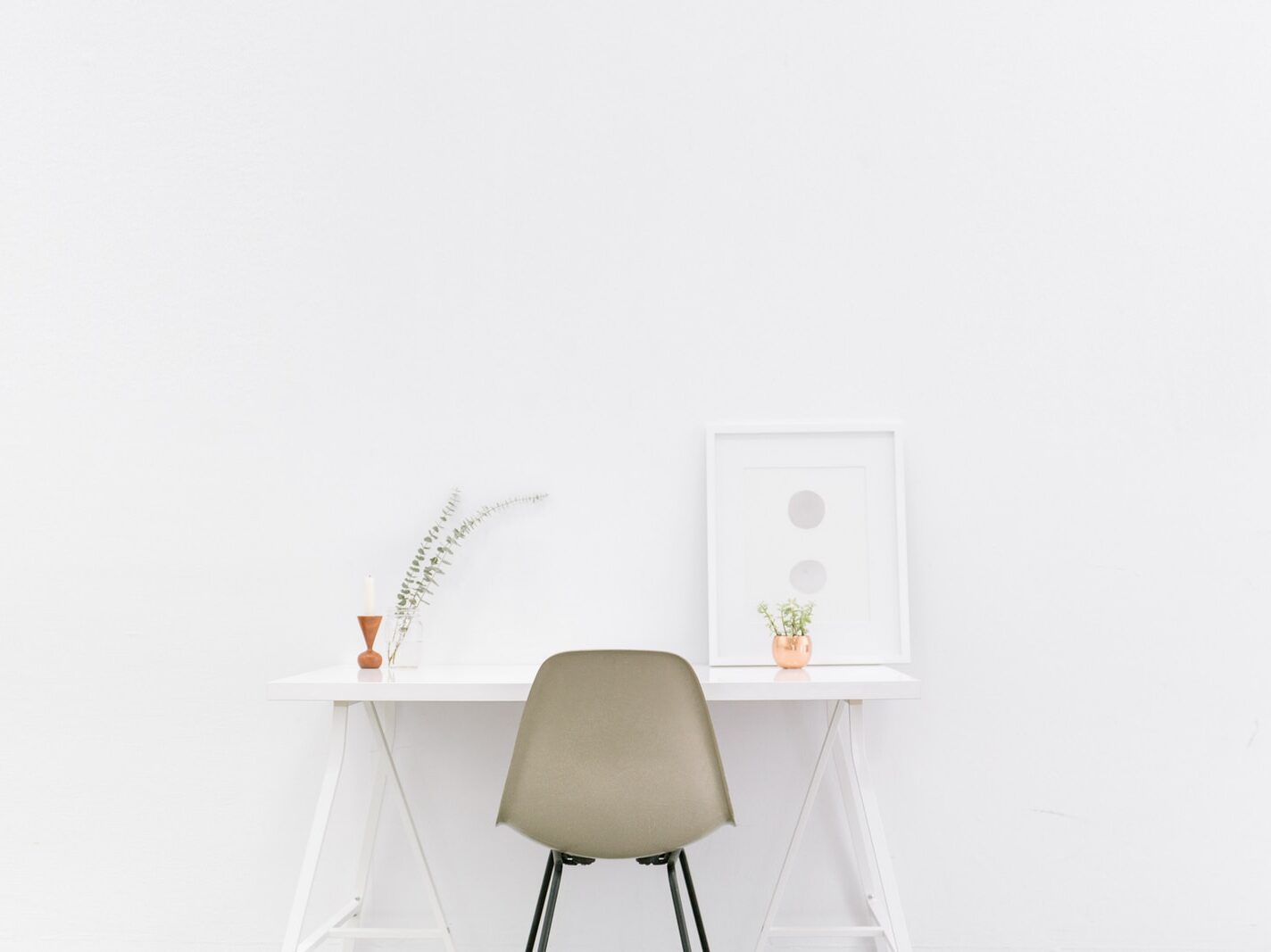 white wooden table near brown chair