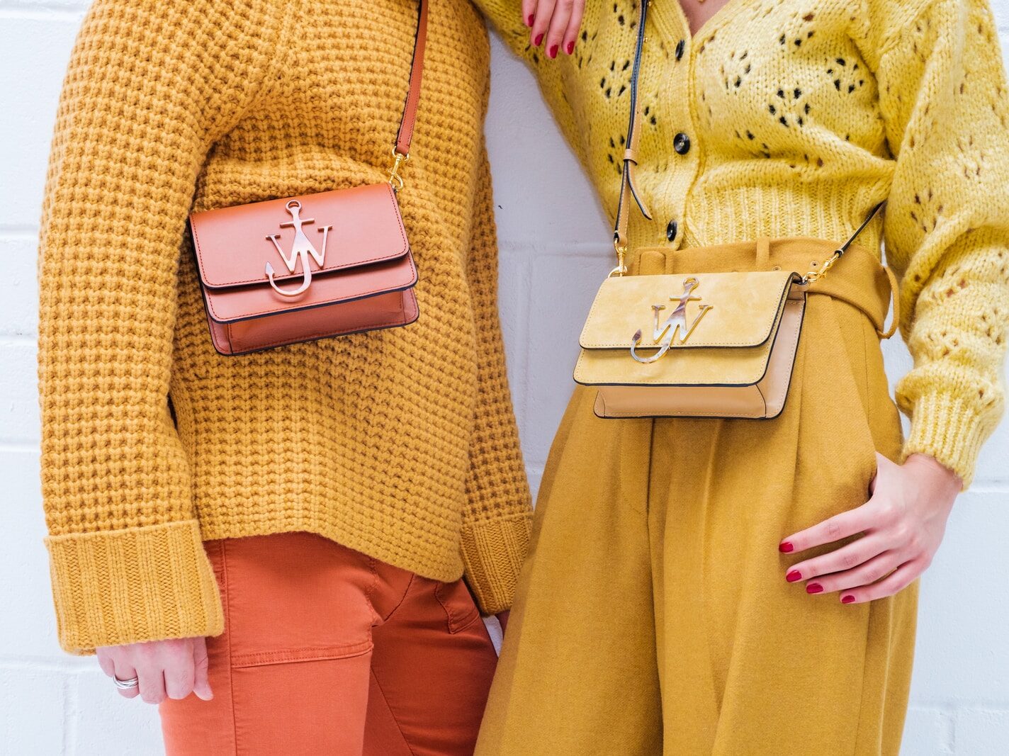 woman in yellow dress holding gold iphone 6