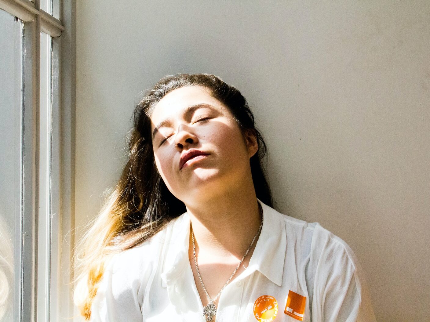 woman standing near window during daytime