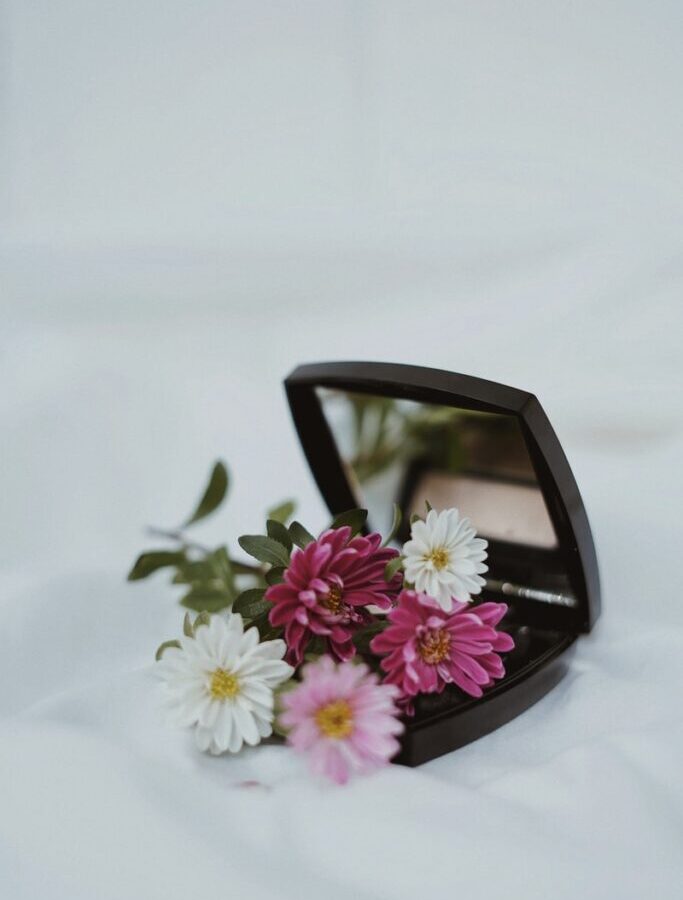 white and pink flower on black frame sunglasses