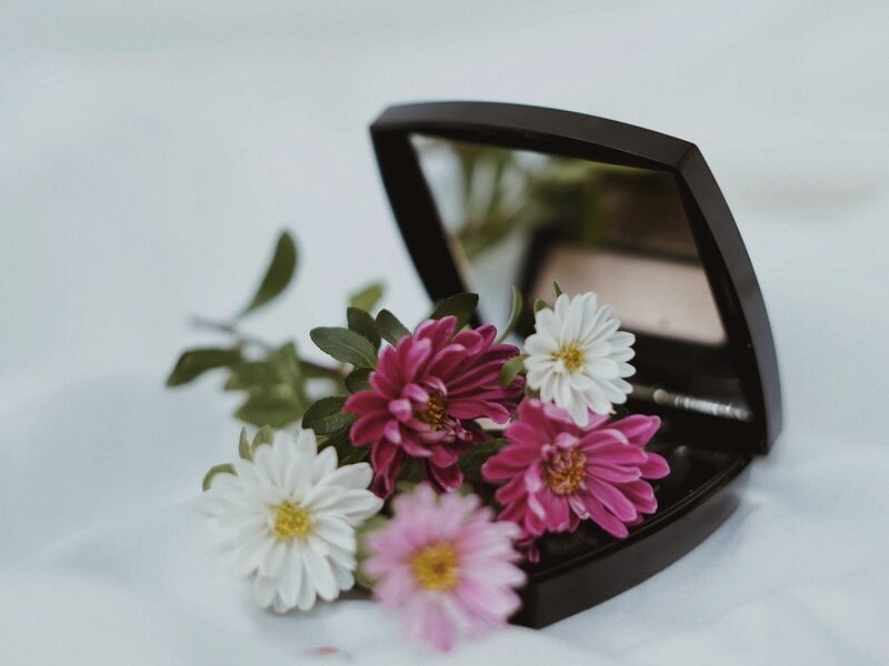 white and pink flower on black frame sunglasses