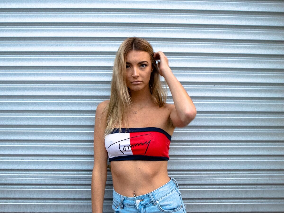 woman standing in front of roll-up door