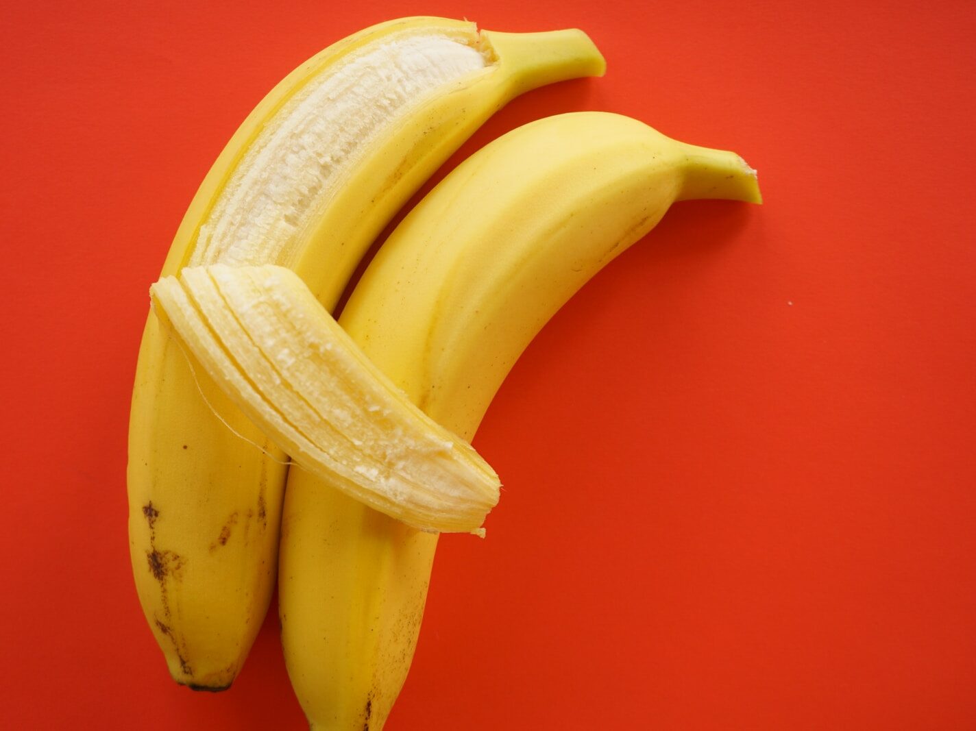 yellow banana fruit on red table