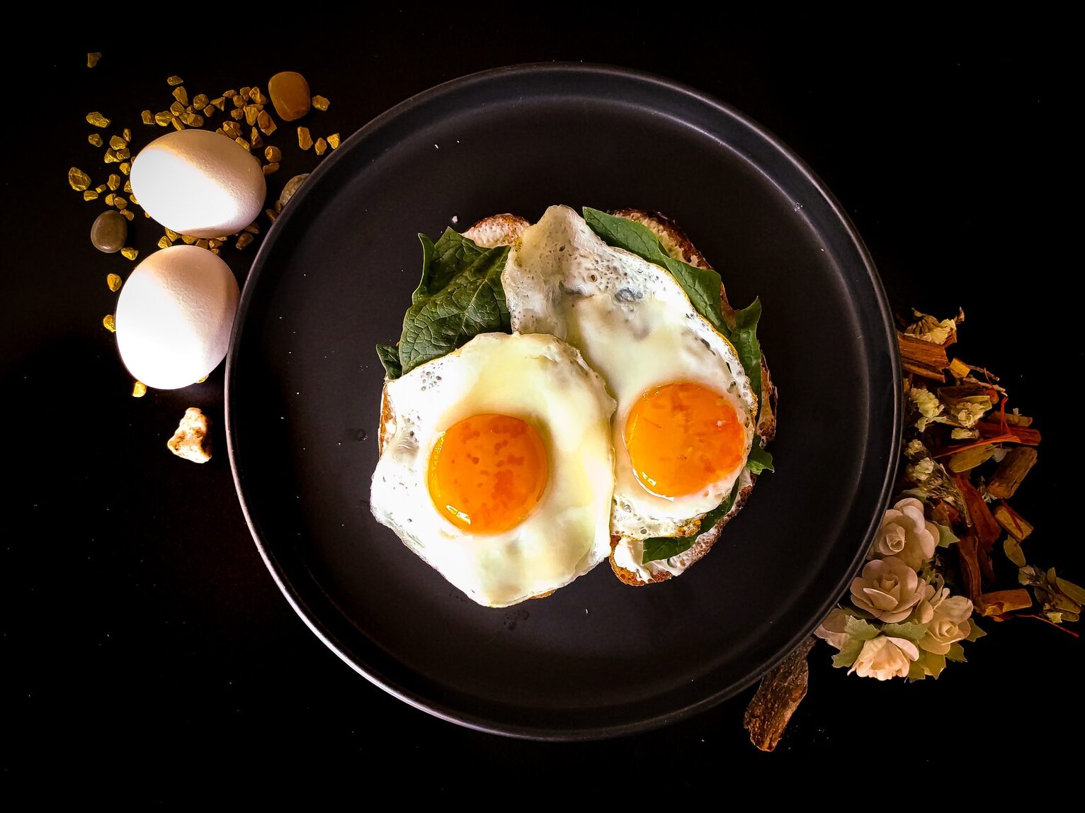 sunny side up egg on black ceramic plate
