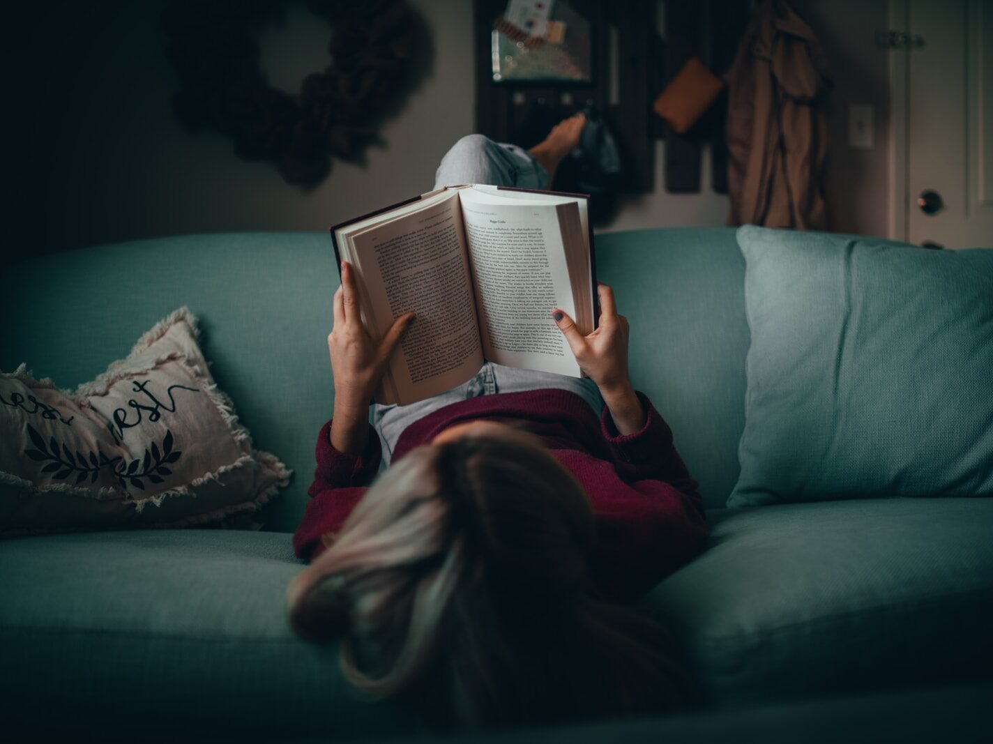 woman in red shirt reading book