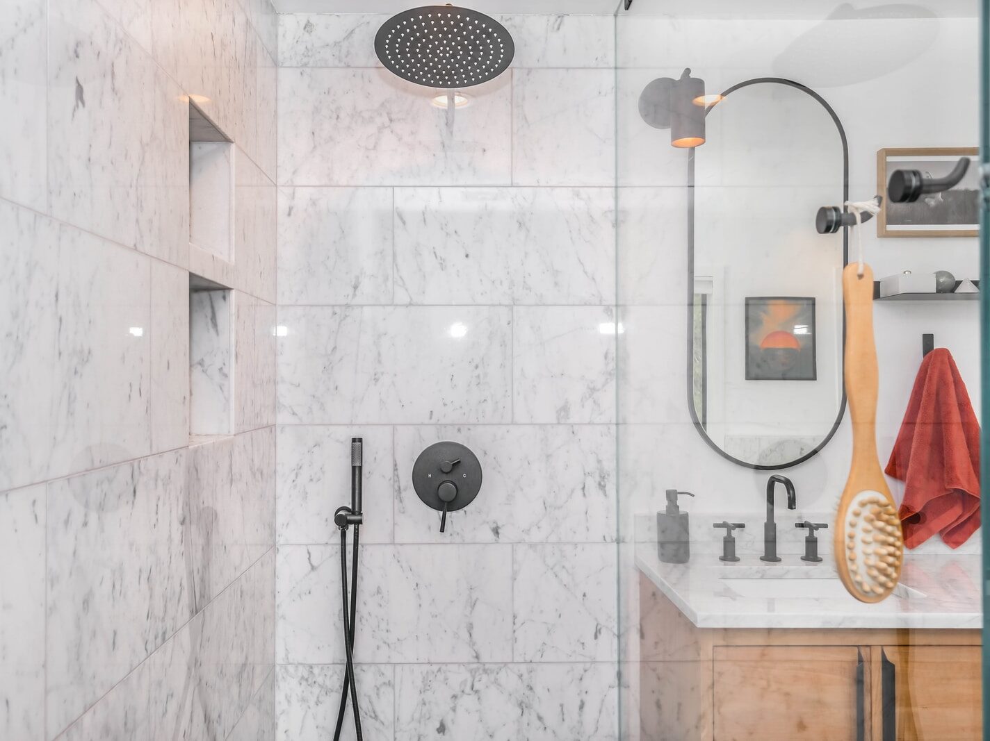 black shower head on white ceramic wall tiles