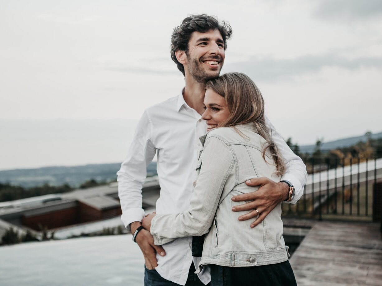man and woman hugging each other
