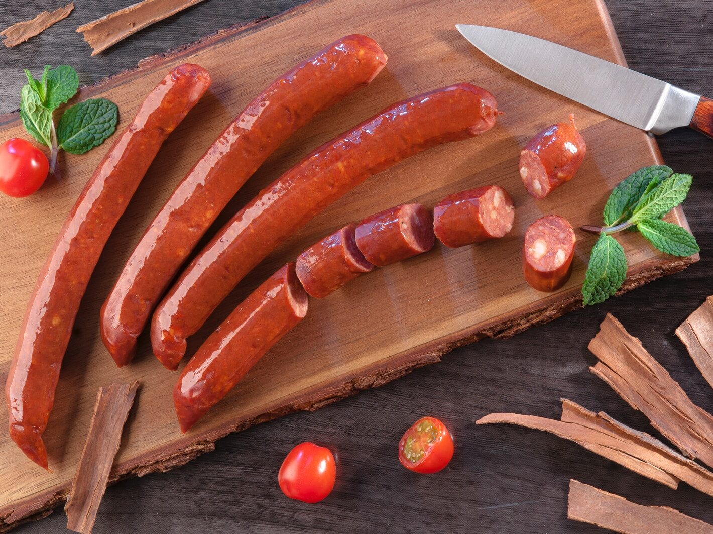 carrots and green chili on brown wooden chopping board