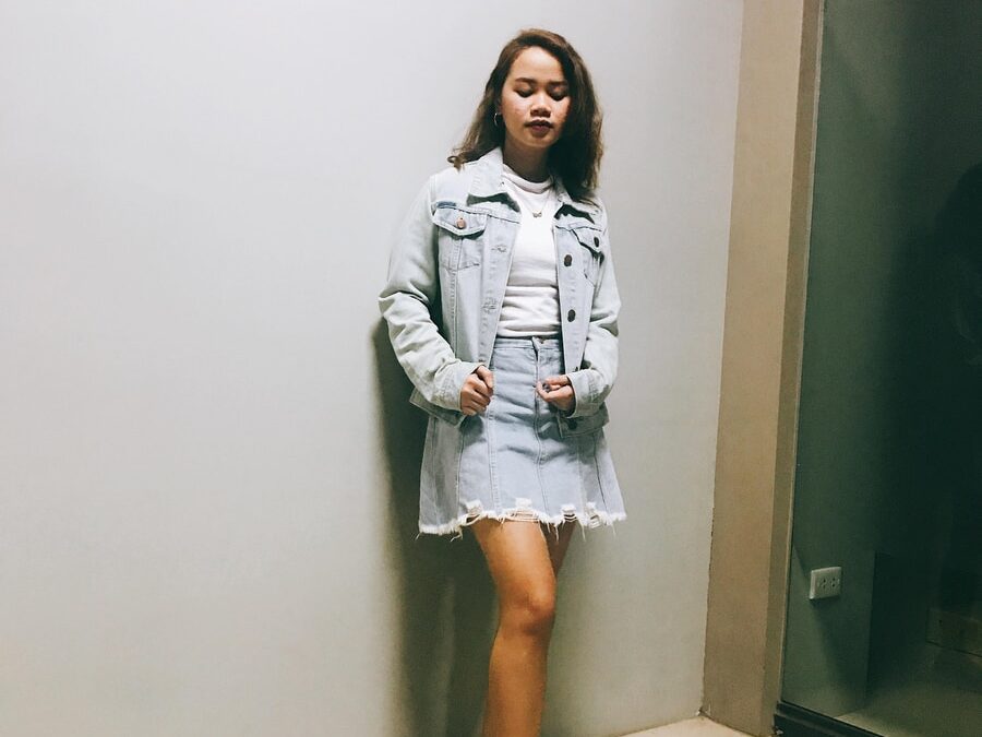 woman standing beside wall