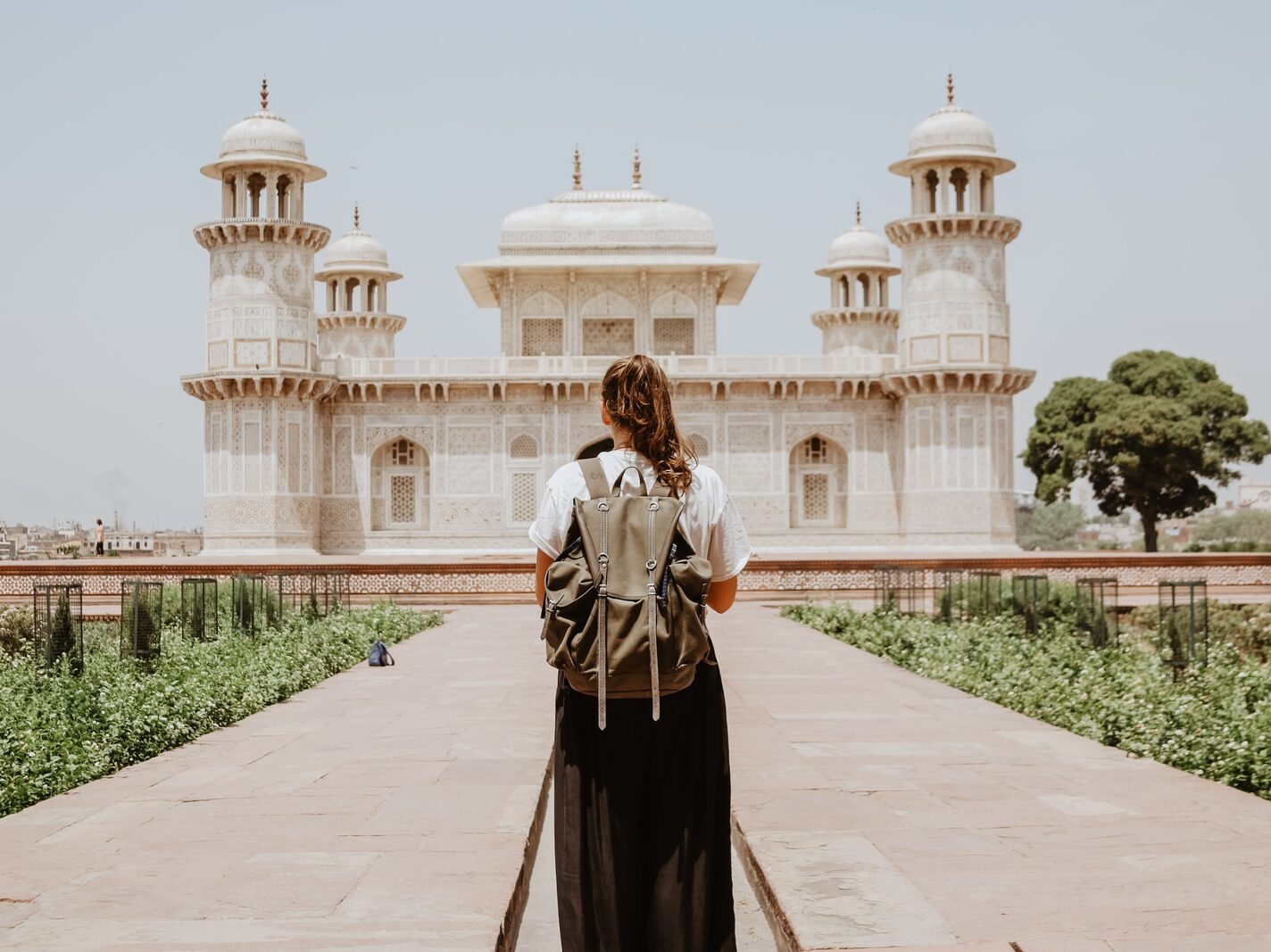 woman near beige painted building