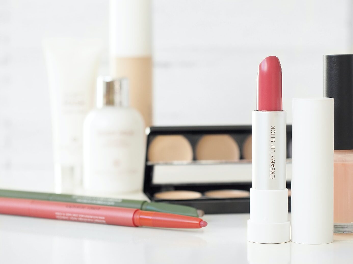 assorted-brand makeup lot on desk