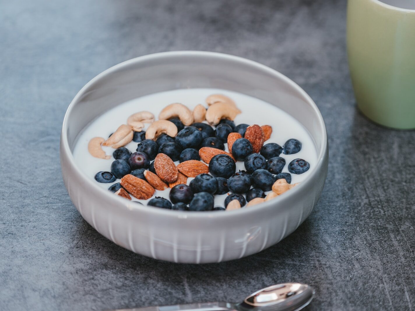 white ceramic bowl with brown and black beans