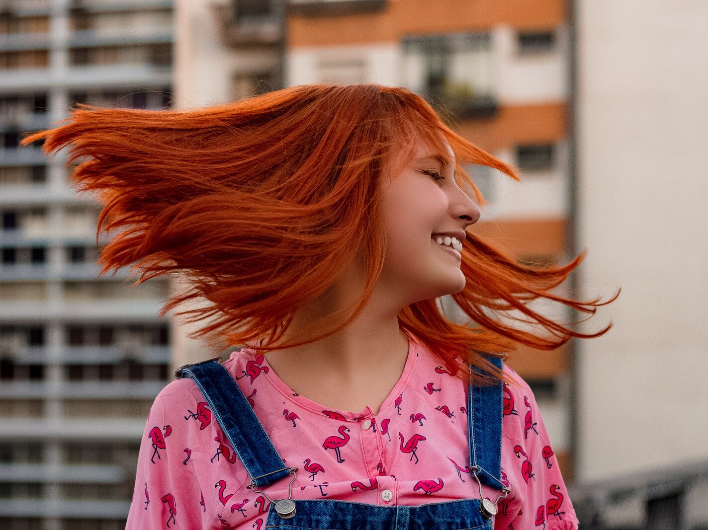 Portrait of smiling woman with red hair