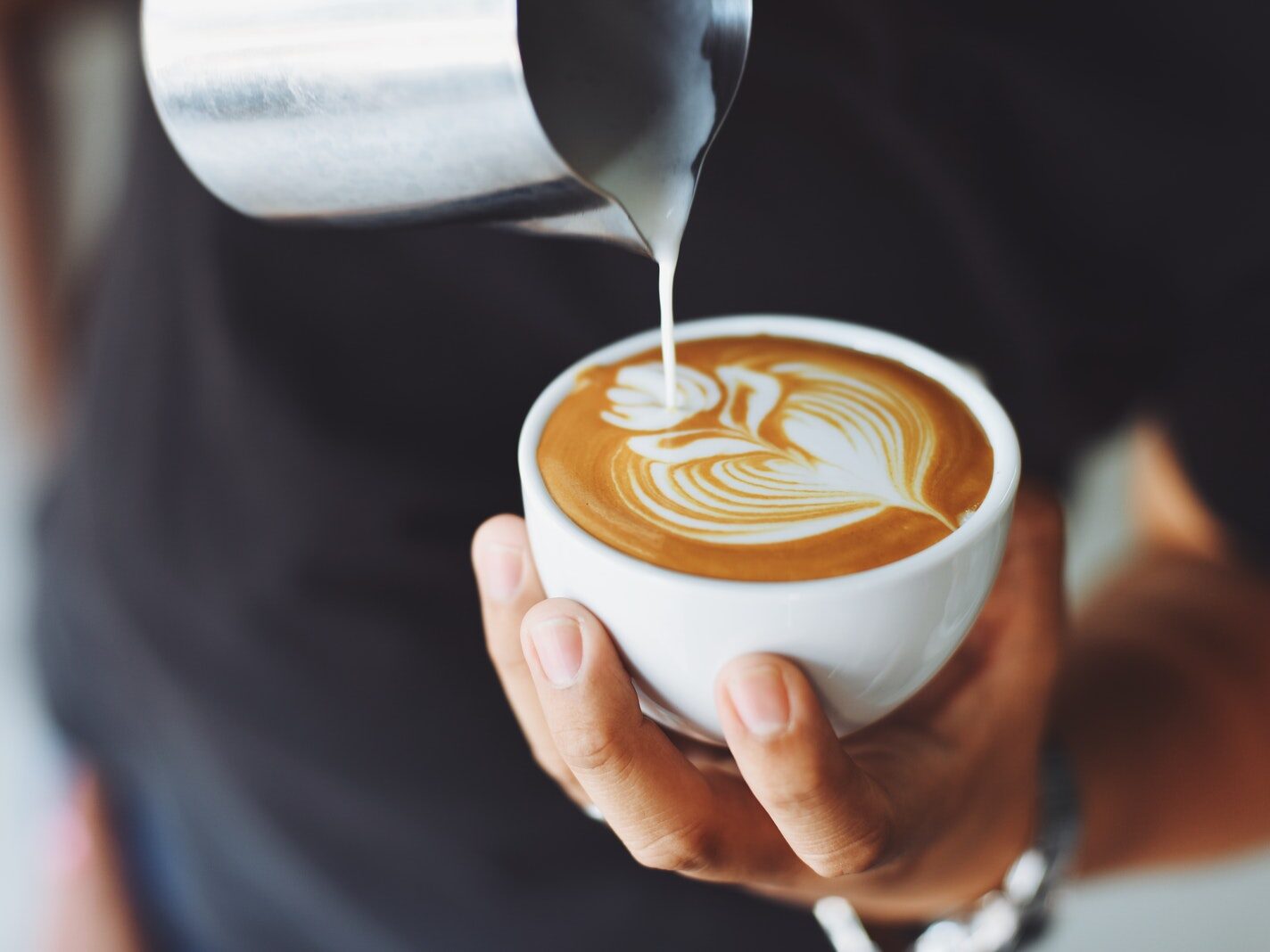 Person Performing Coffee Art