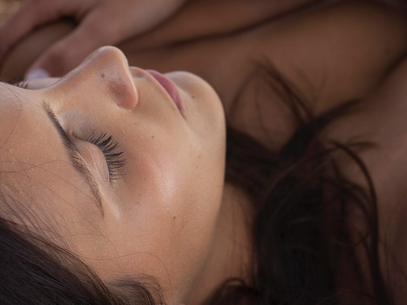 woman with pink lipstick and black mascara