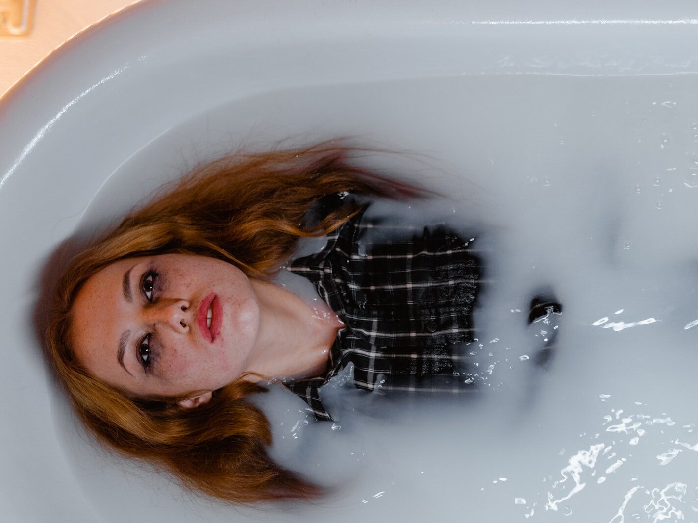 A Woman Lying on the Bathtub