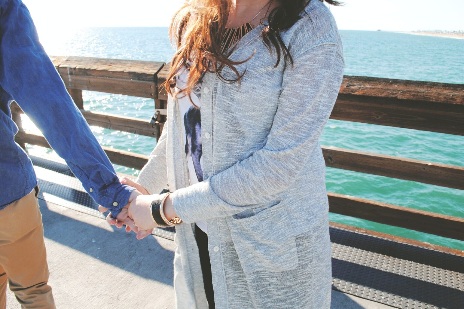 man holding woman's hands