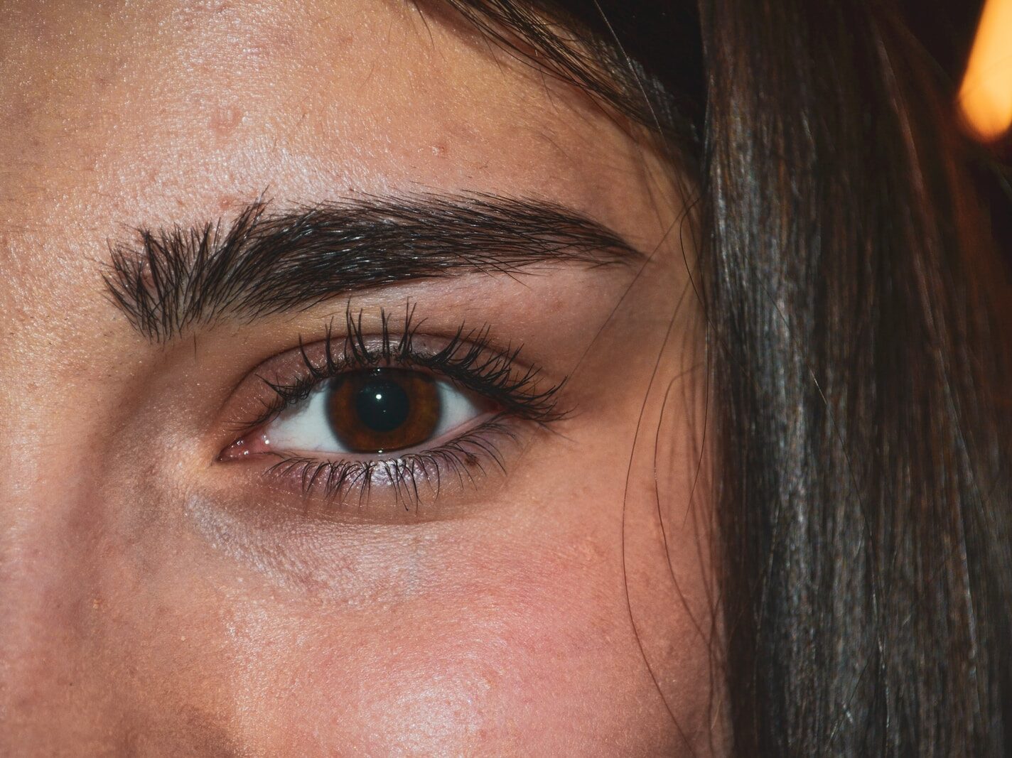 woman with black hair and blue eyes