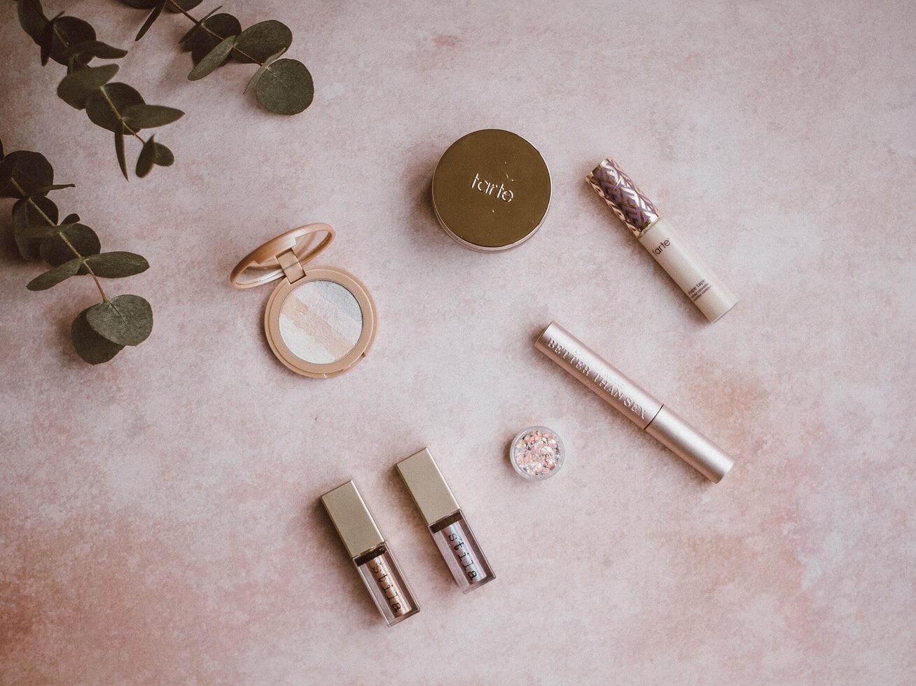 assorted makeup kit set on gray surface