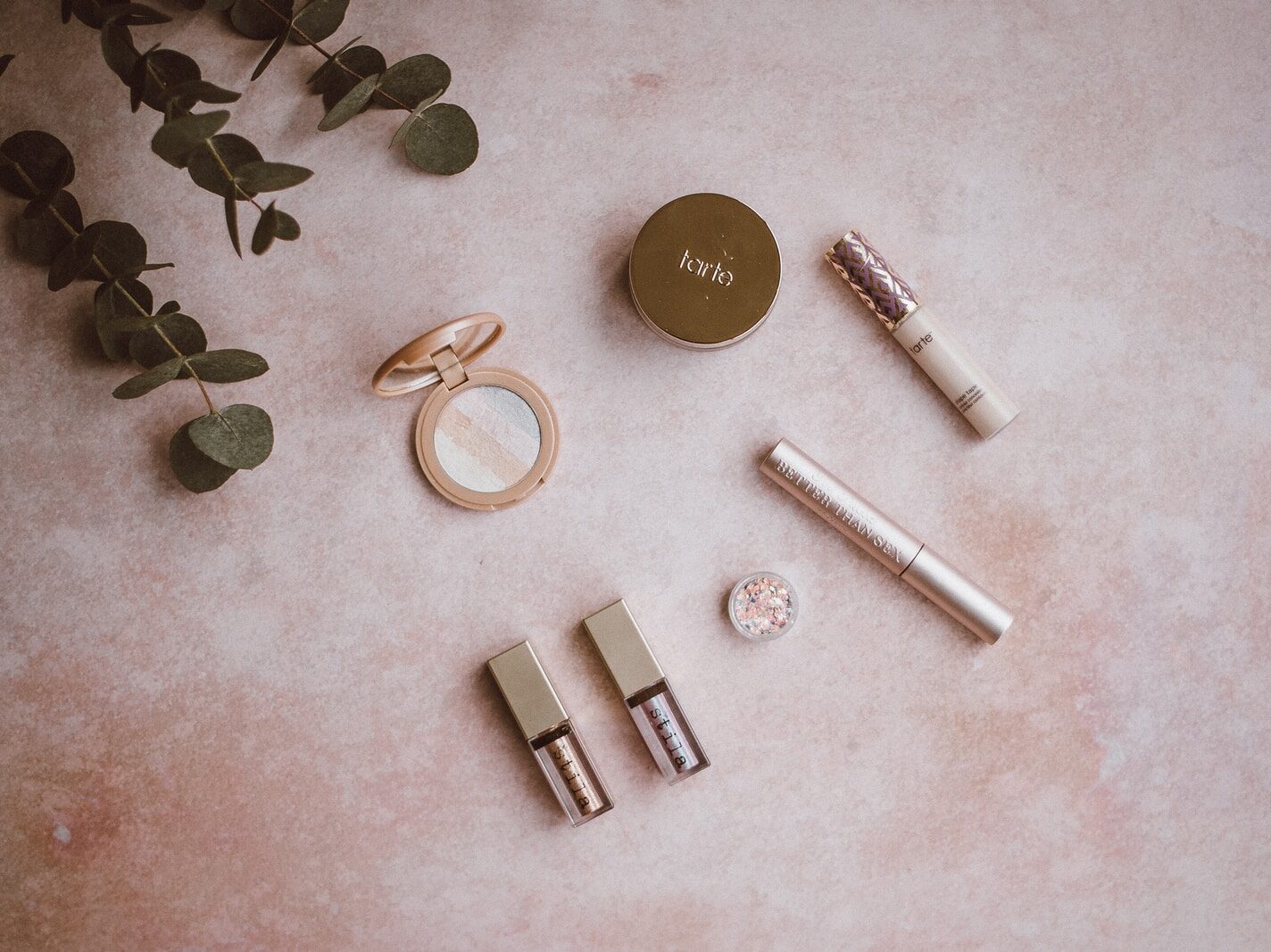 assorted makeup kit set on gray surface