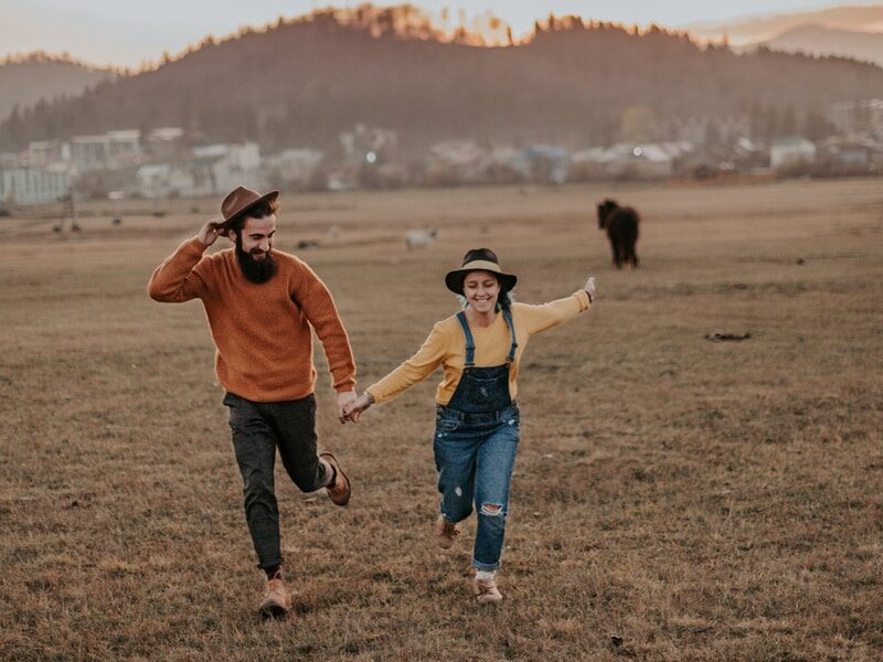 man holdind woman hand