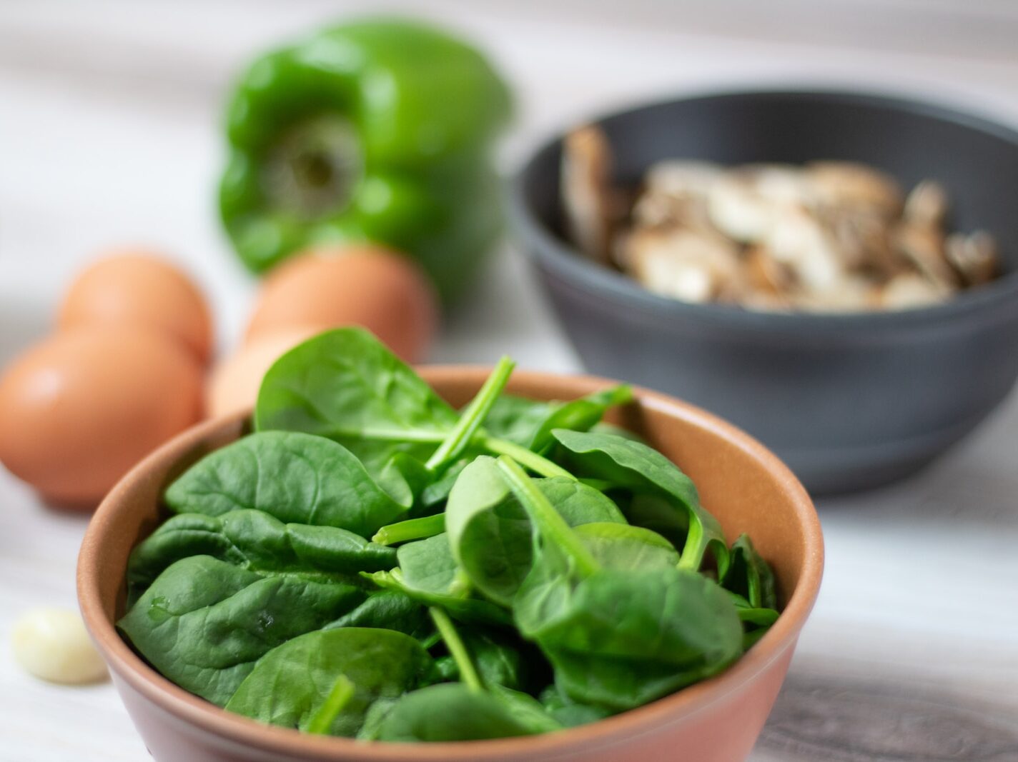 green vegetable on white ceramic bowl