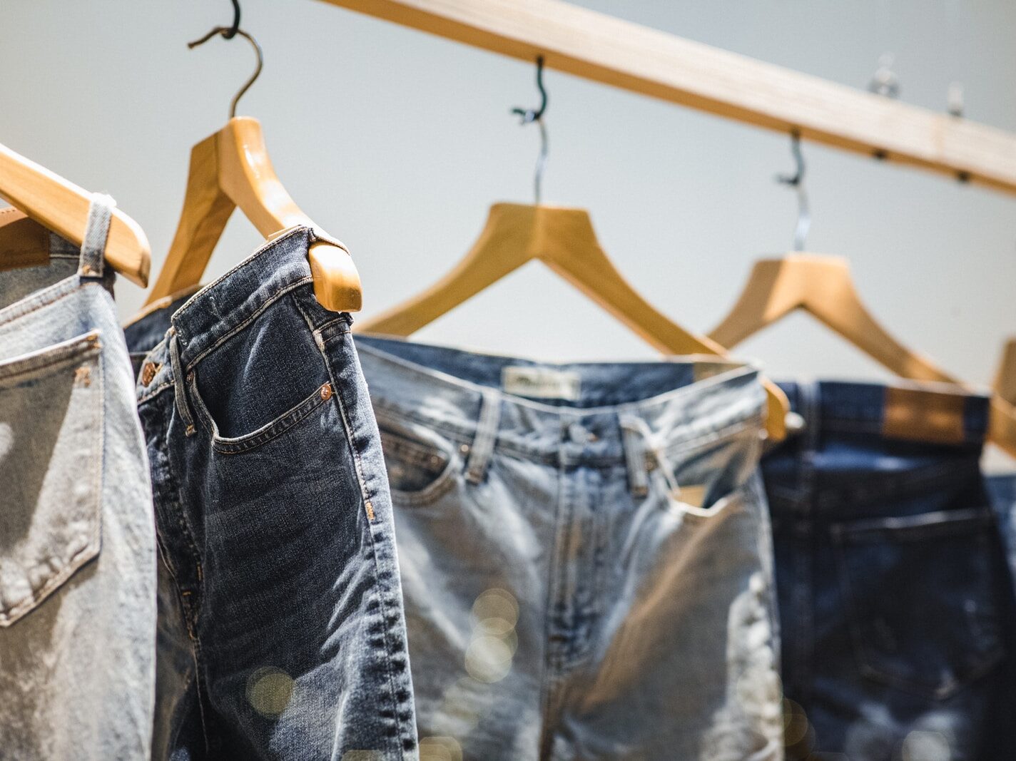 selective focus photography of hanged denim jeans