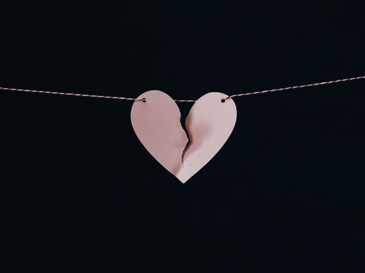 broken heart hanging on wire