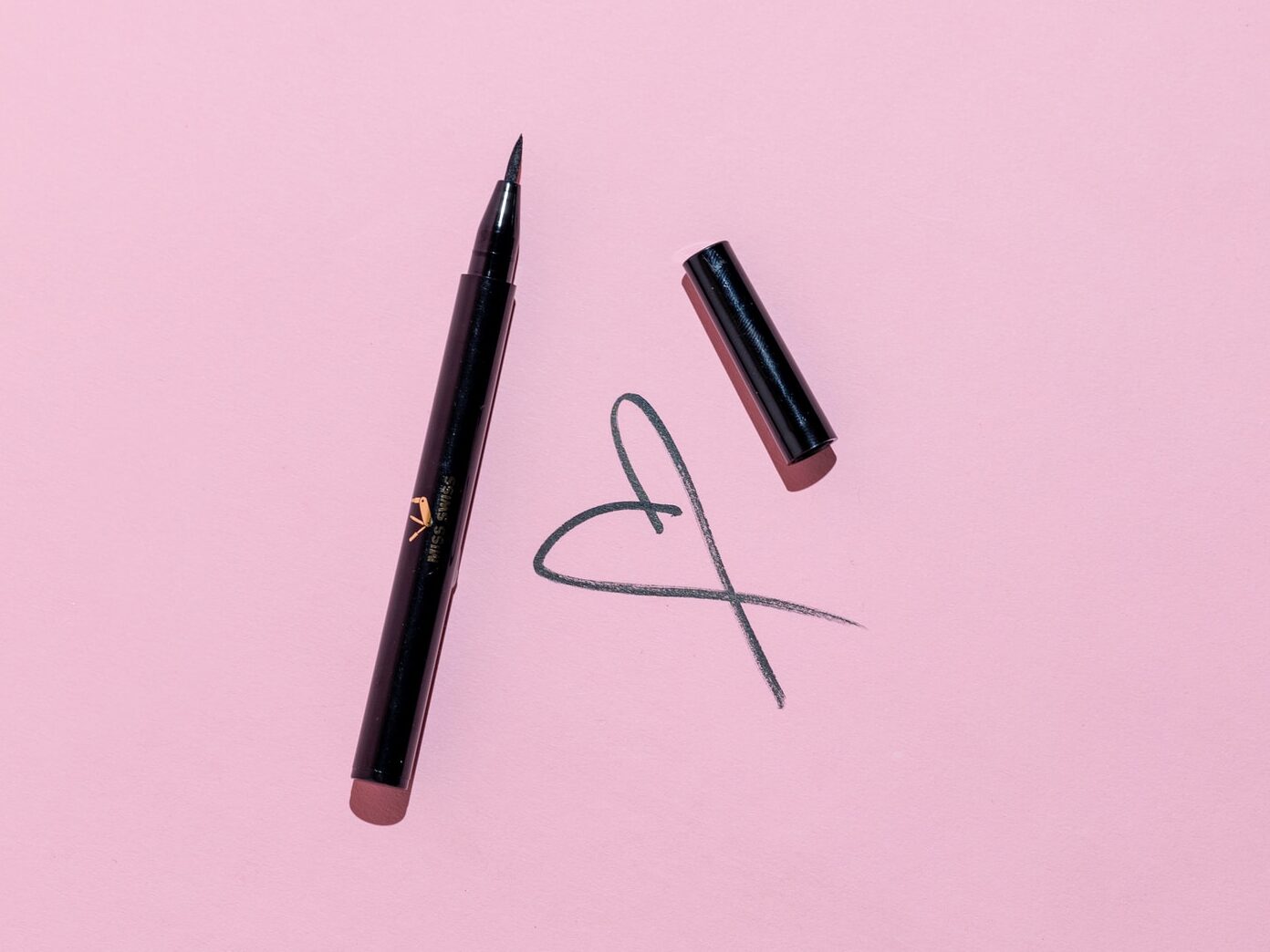 black pen and black framed eyeglasses