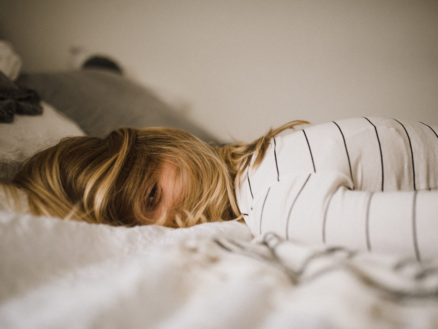 woman lying on bed