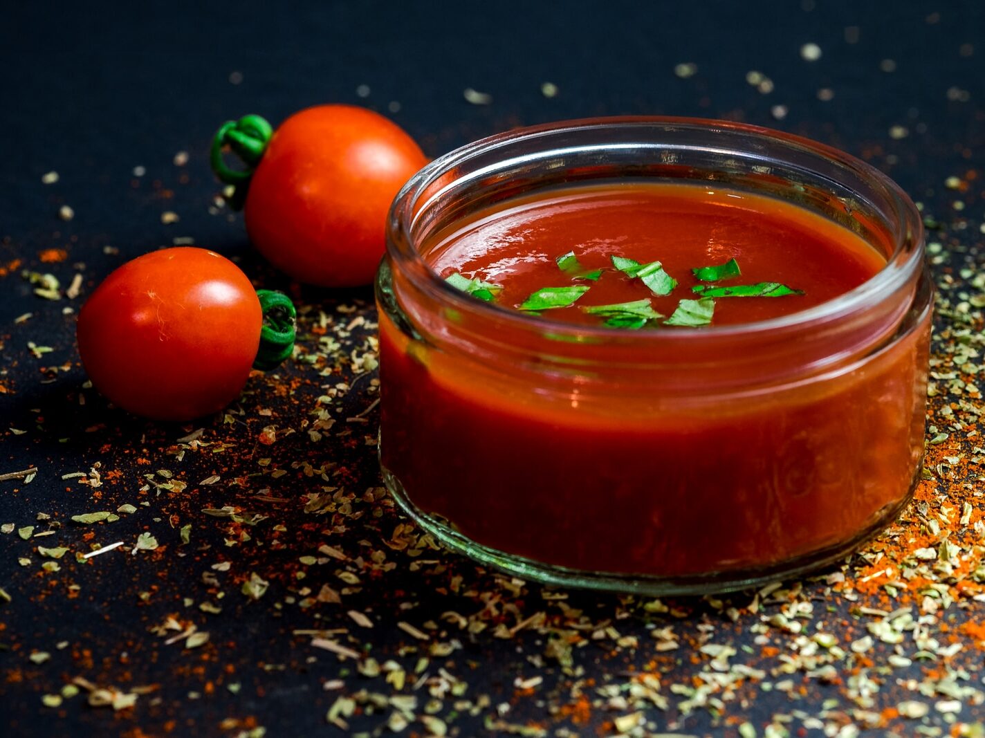 tomato and tomato puree with parsley in bowl