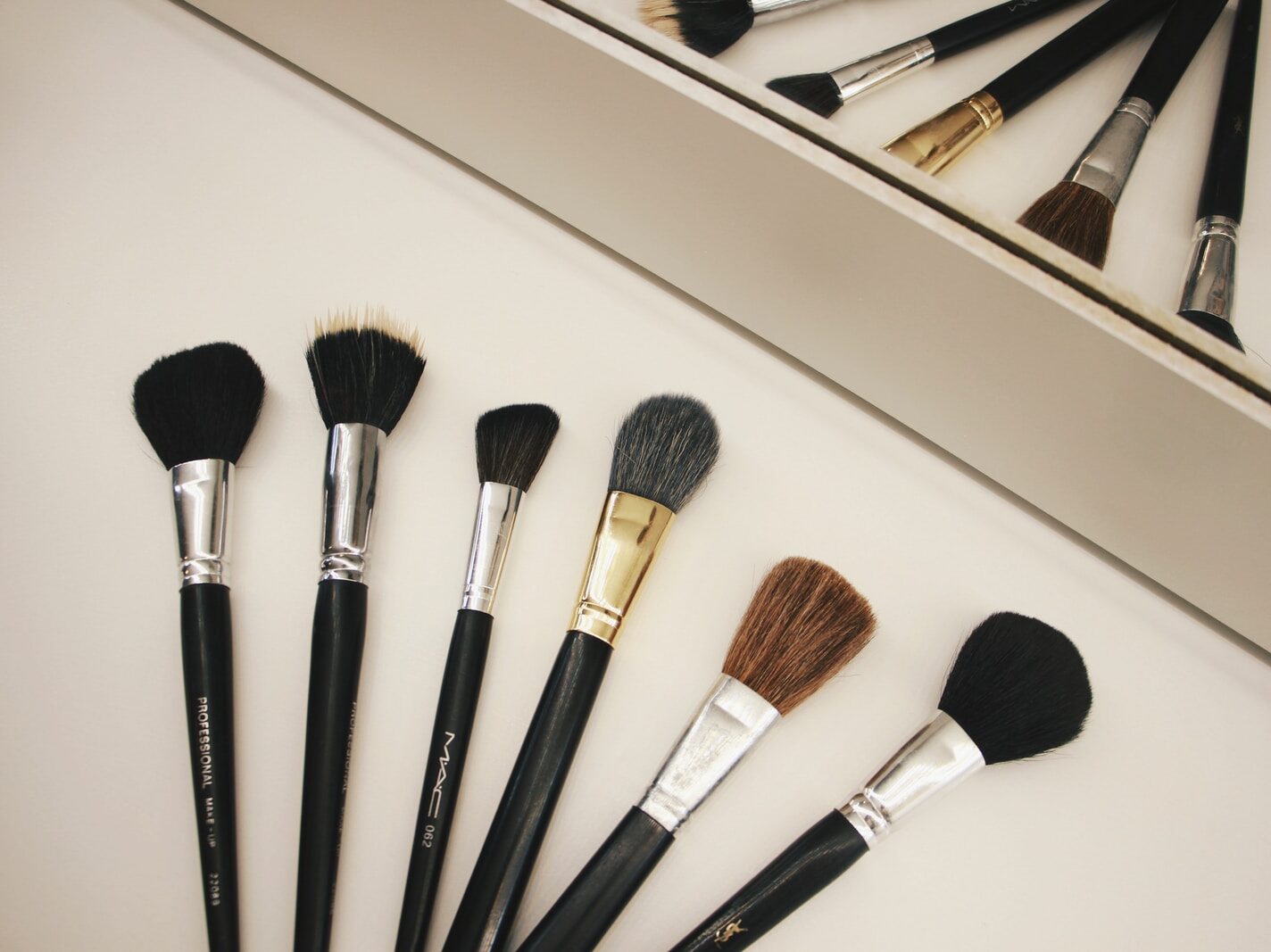 assorted-color makeup brushes