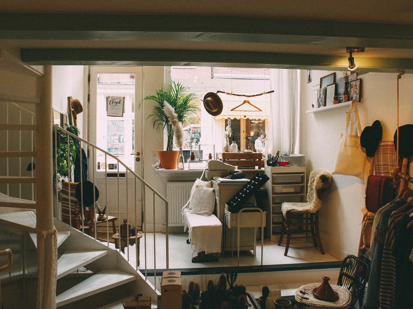 empty spiral staircase near white wooden door