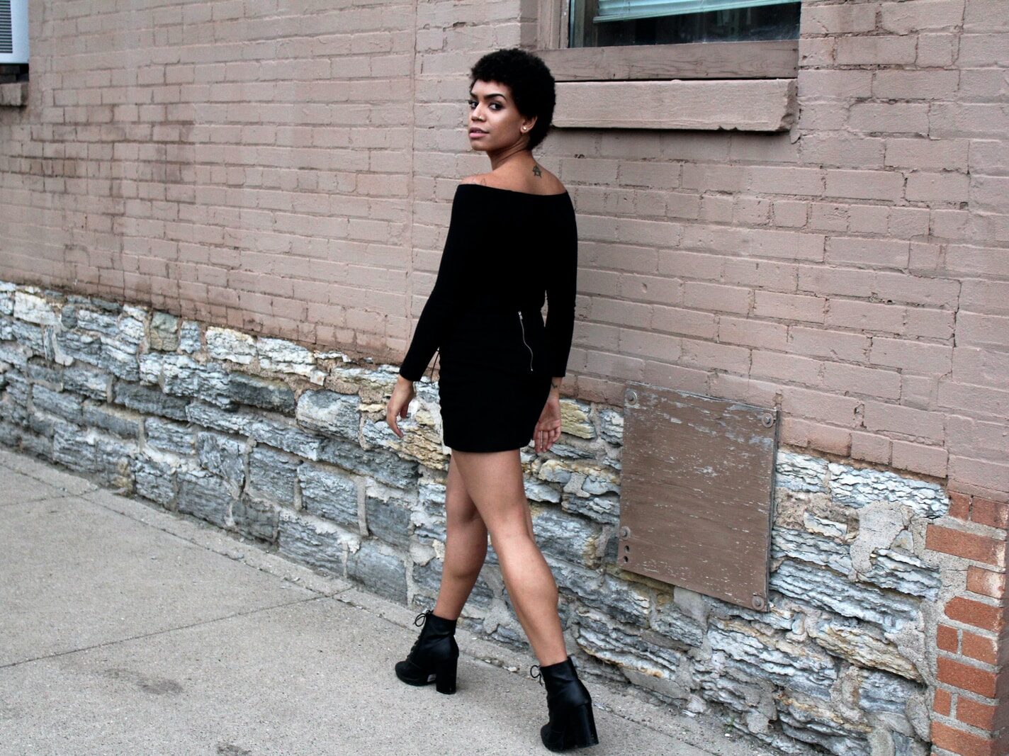 woman walking near wall