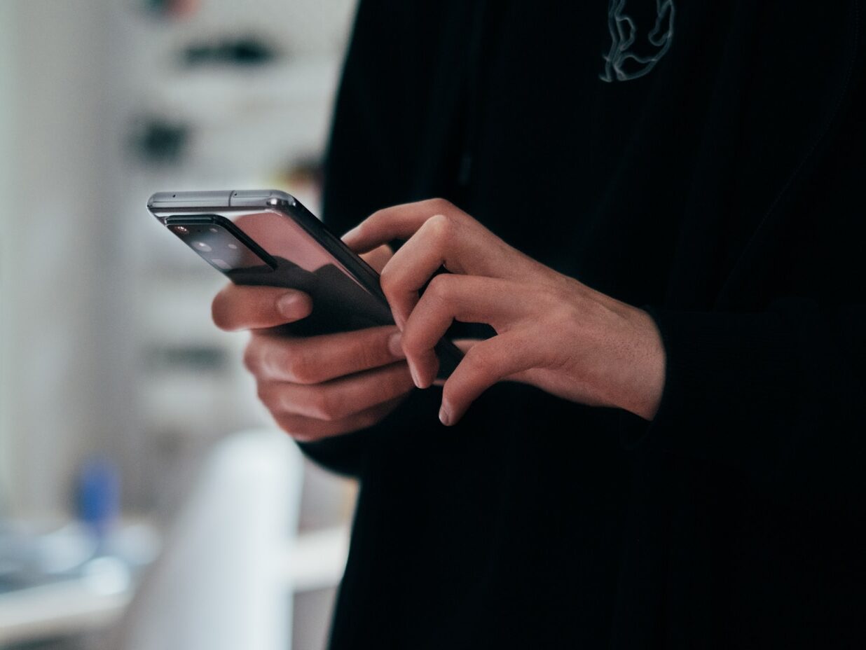 person holding black android smartphone