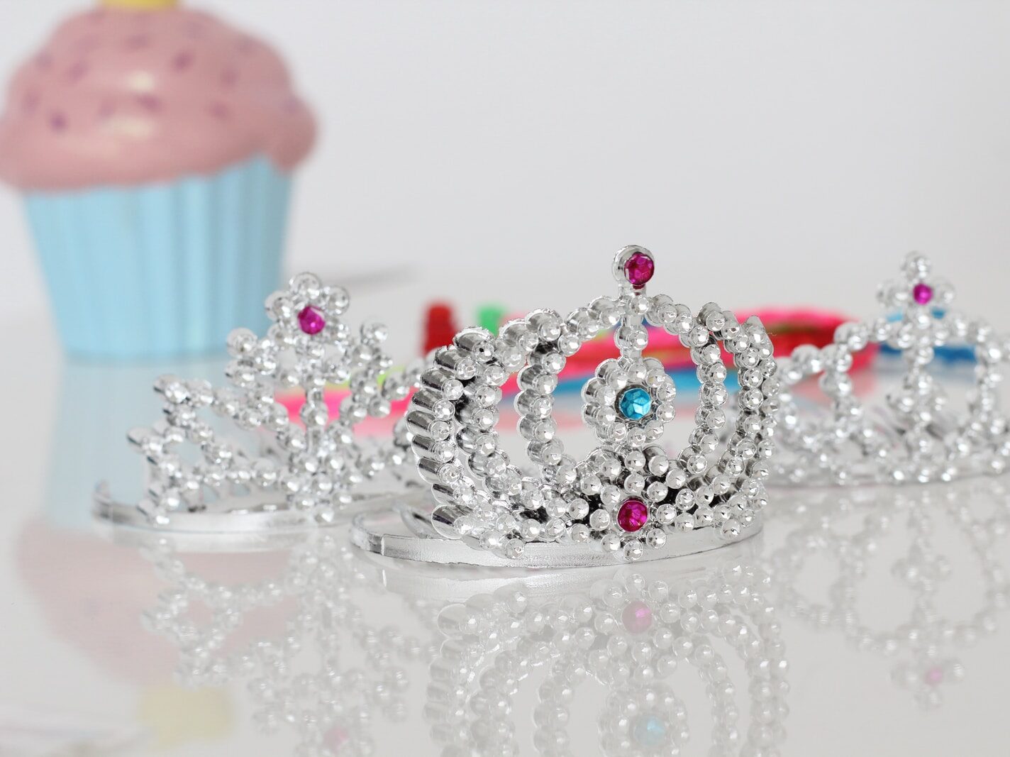 silver-colored tiara rings with clear gemstones