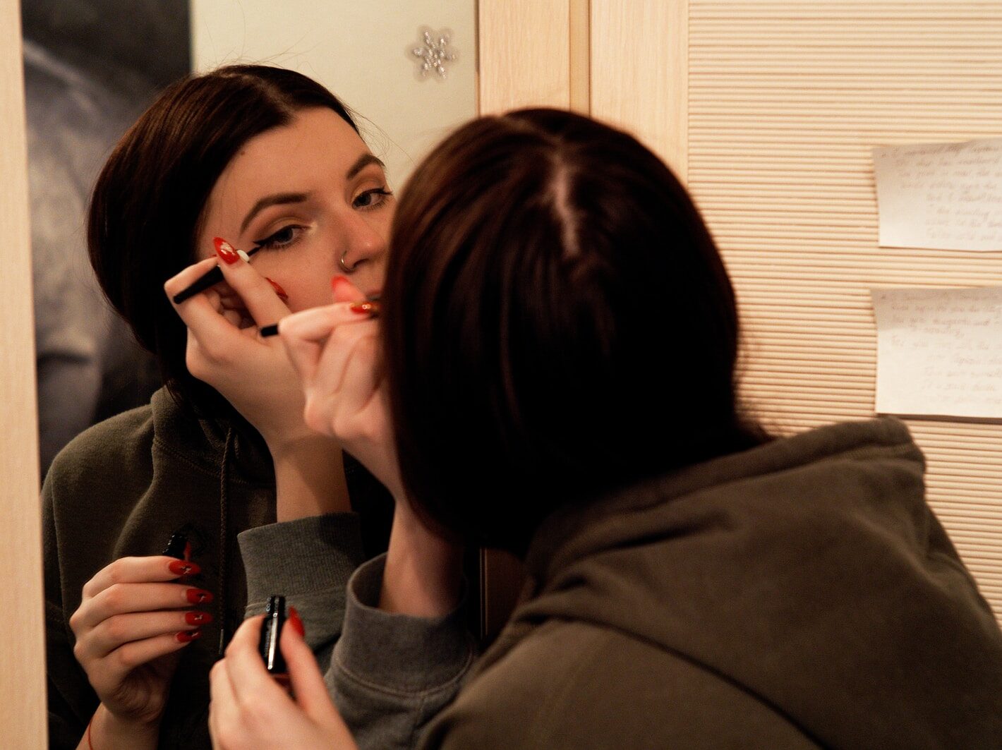 woman in gray shirt smoking cigarette