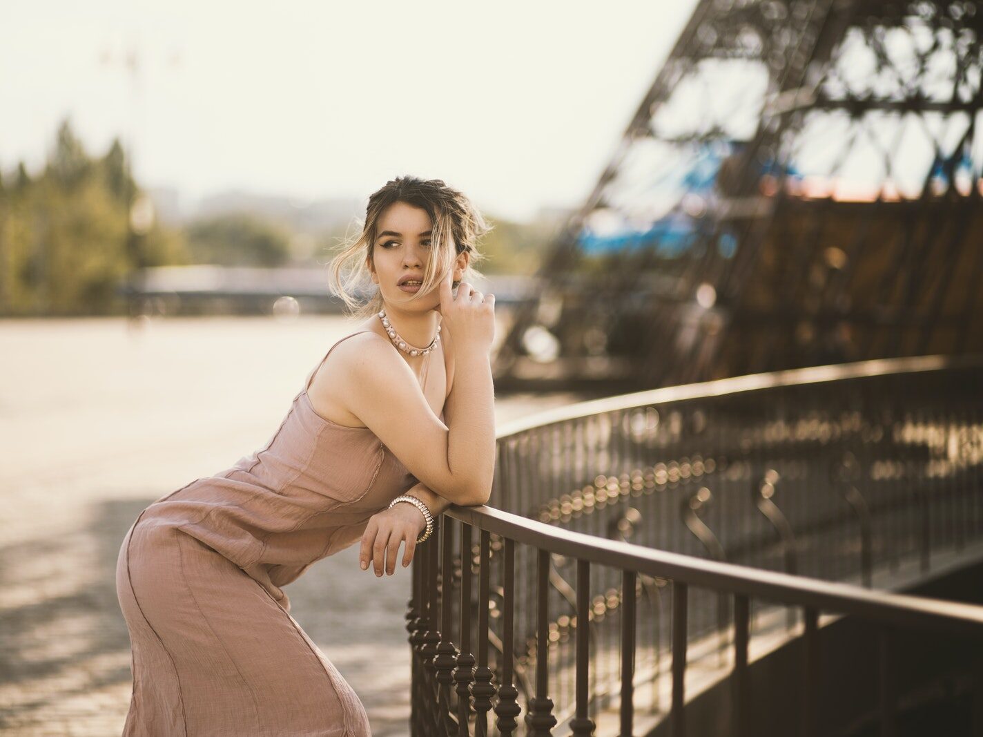 Woman Resting Her Arms On Railing