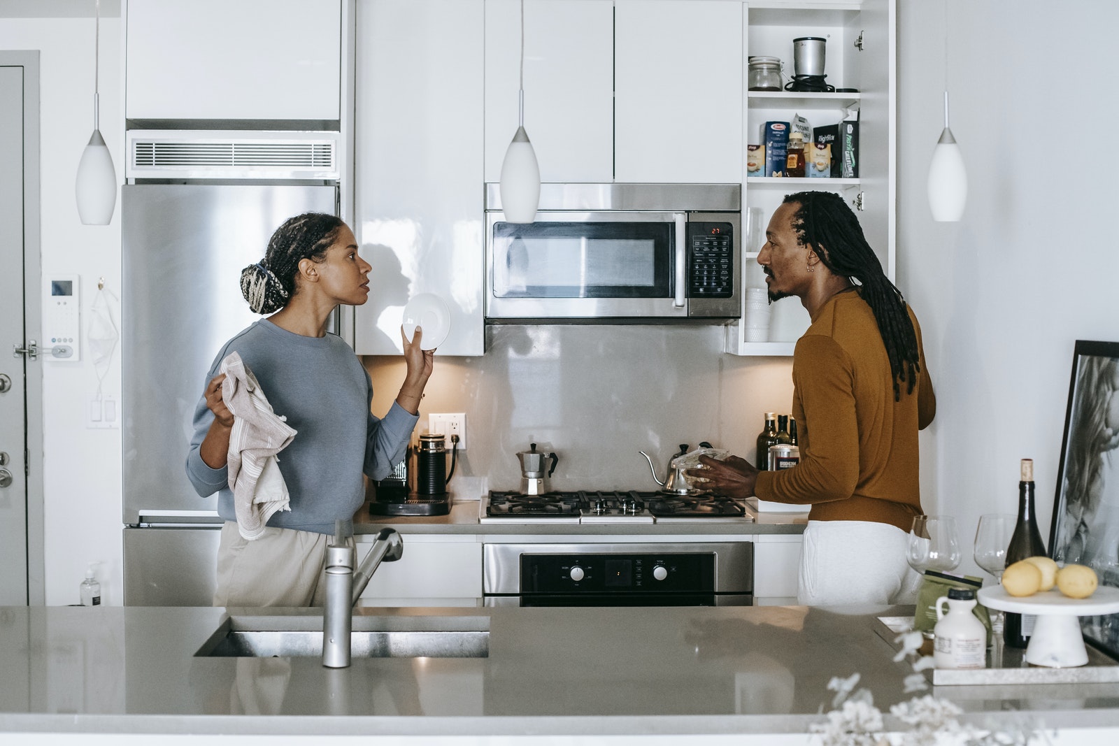 African American couple having conflict in kitchen at home