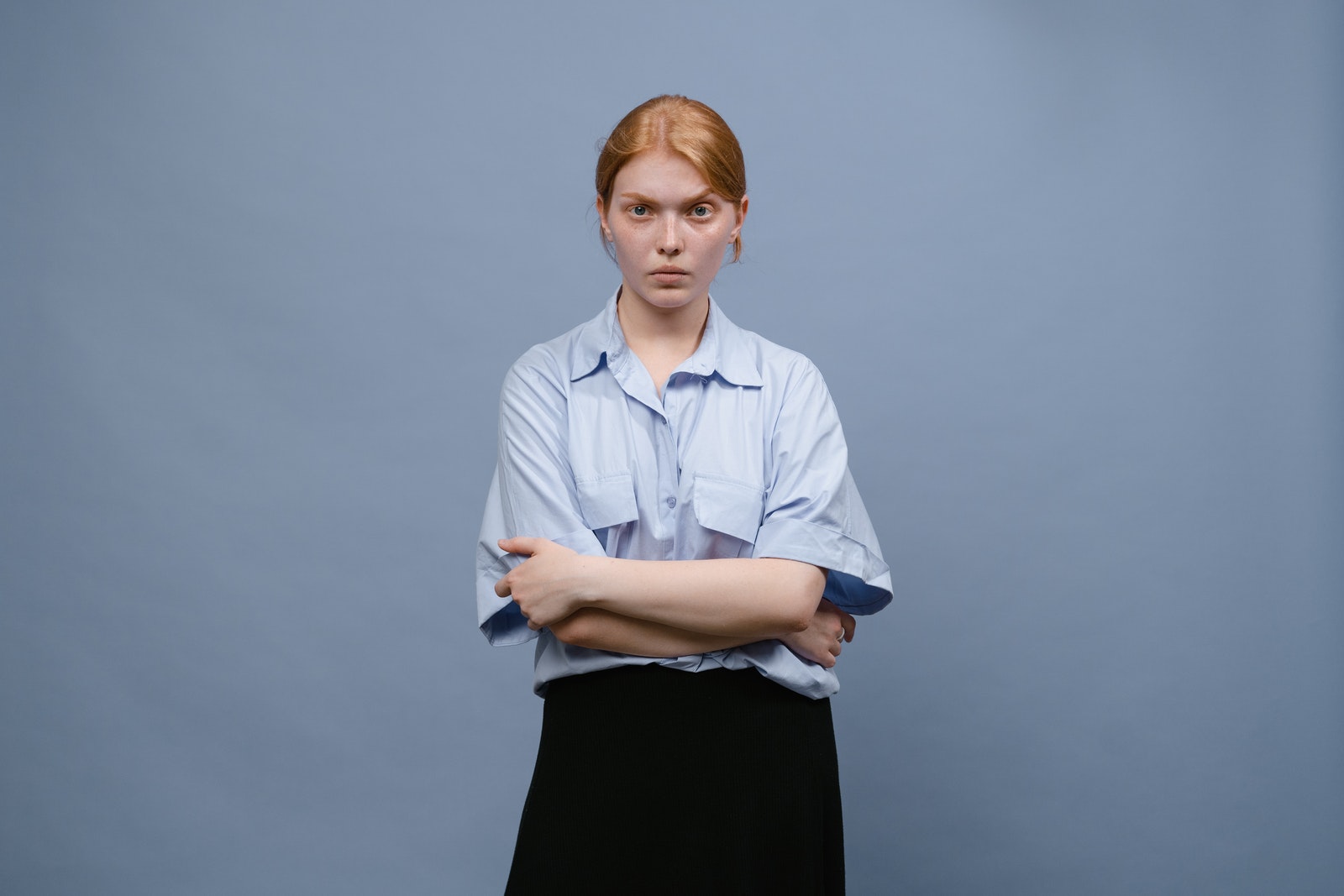 Tima Miroshnichenko - ČasProŽeny.cz A Woman in Blue Button Up Shirt and Black Skirt
