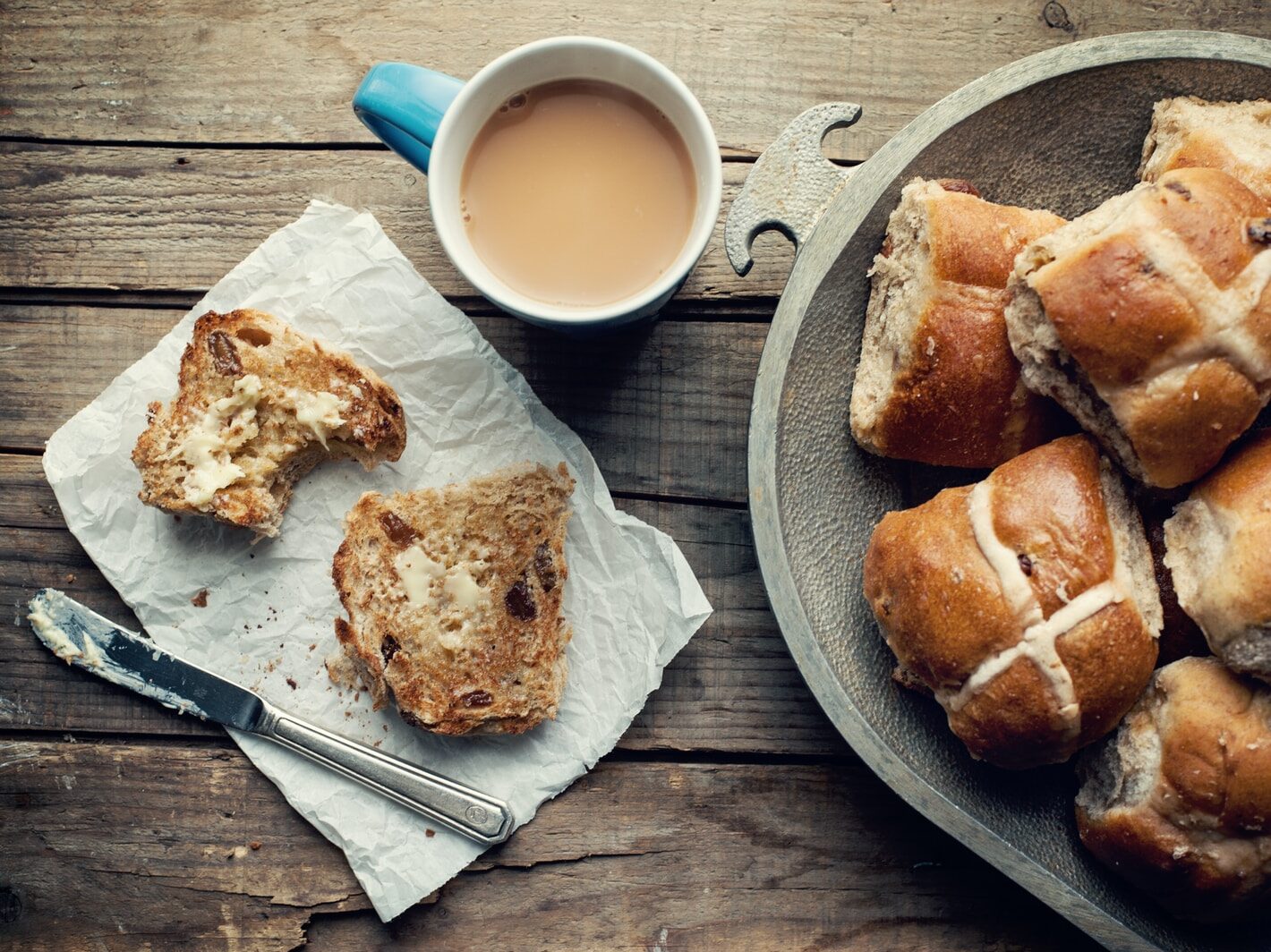 baked pastries in gray bowl near white cup filled with coffee