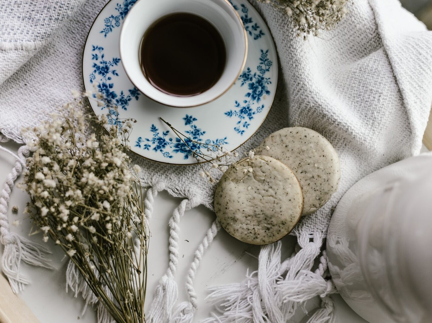cup of coffee and biscuits on tray