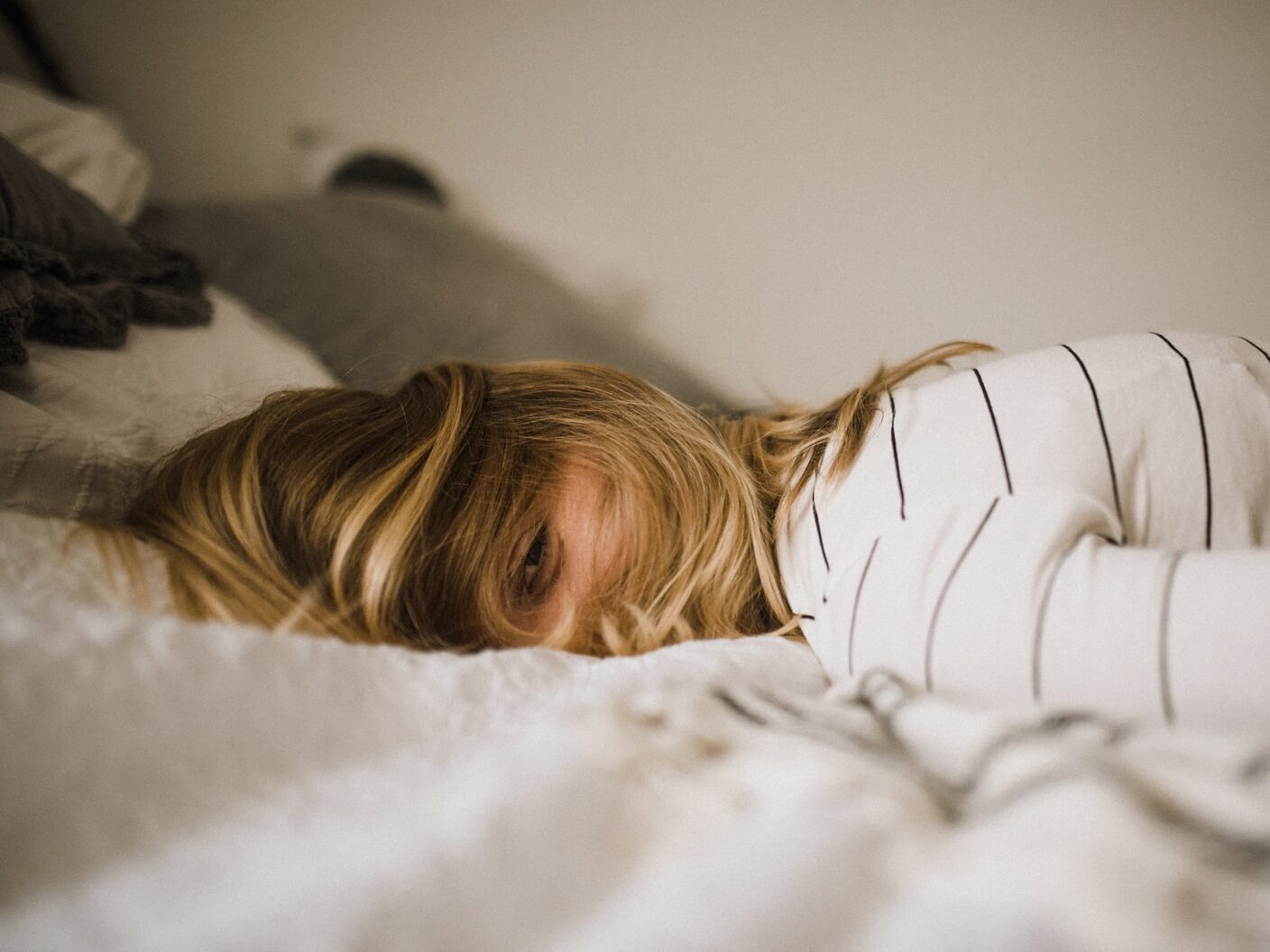 woman lying on bed
